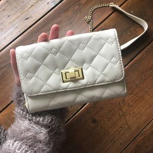 Almost-new ivory / brass quilted clutch with strap